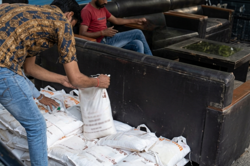 Shri Radhe Maa Charitable Society, New Delhi delivers food packets containing food grains